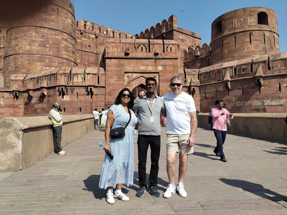 Mr. Verma with tourists smiling